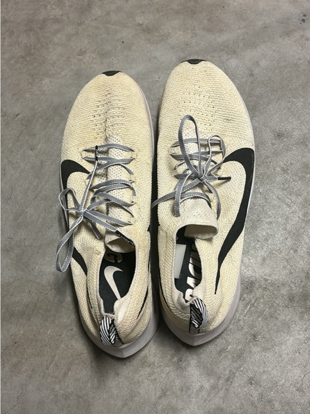 Nike Flyknit Sneakers in Cream with Black Swoosh